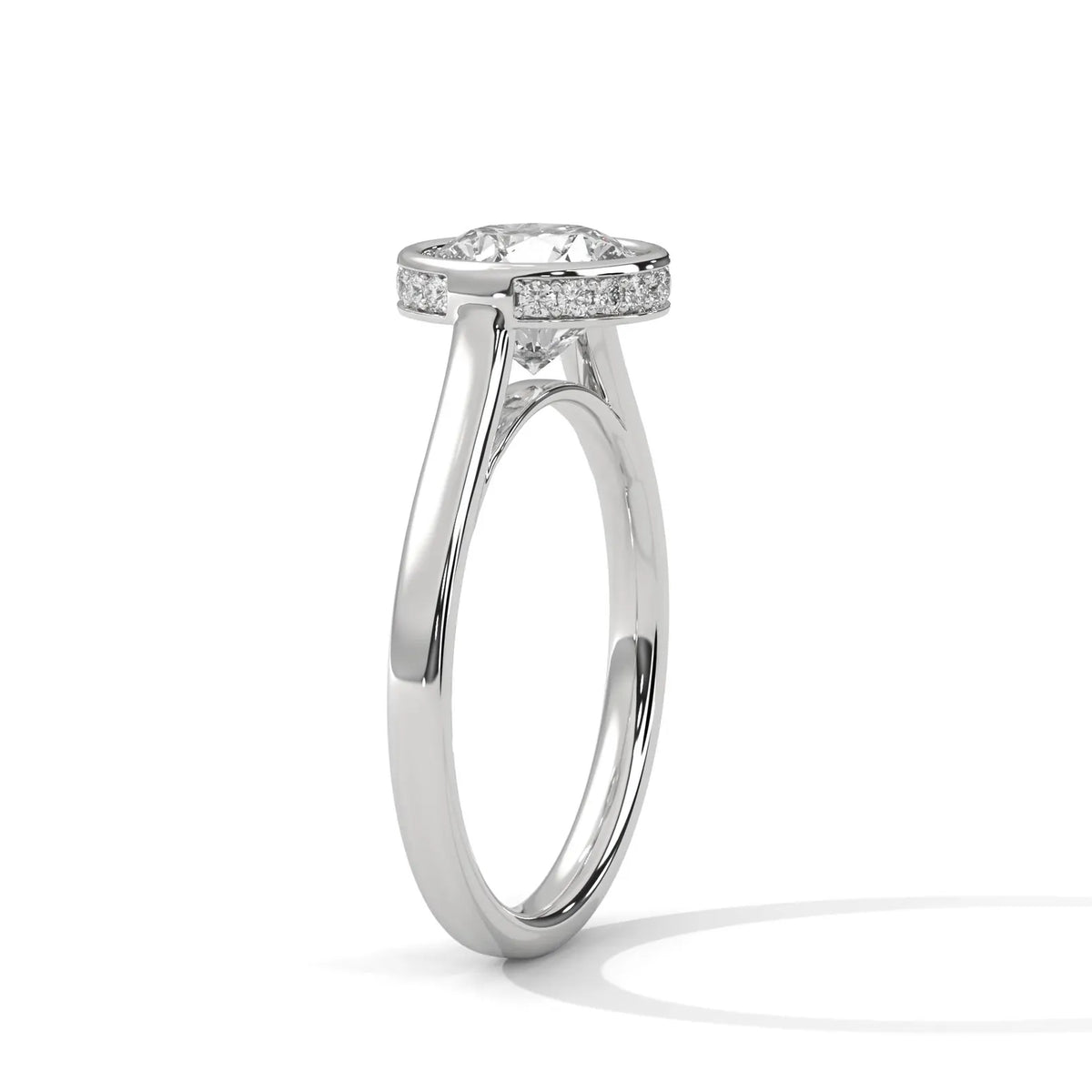 Angled side profile showing the pavé diamond collar rim around the bezel head and sleek white gold band.