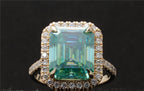 Top-down view showcasing the large 4 CT green emerald cut center stone surrounded by a brilliant halo.