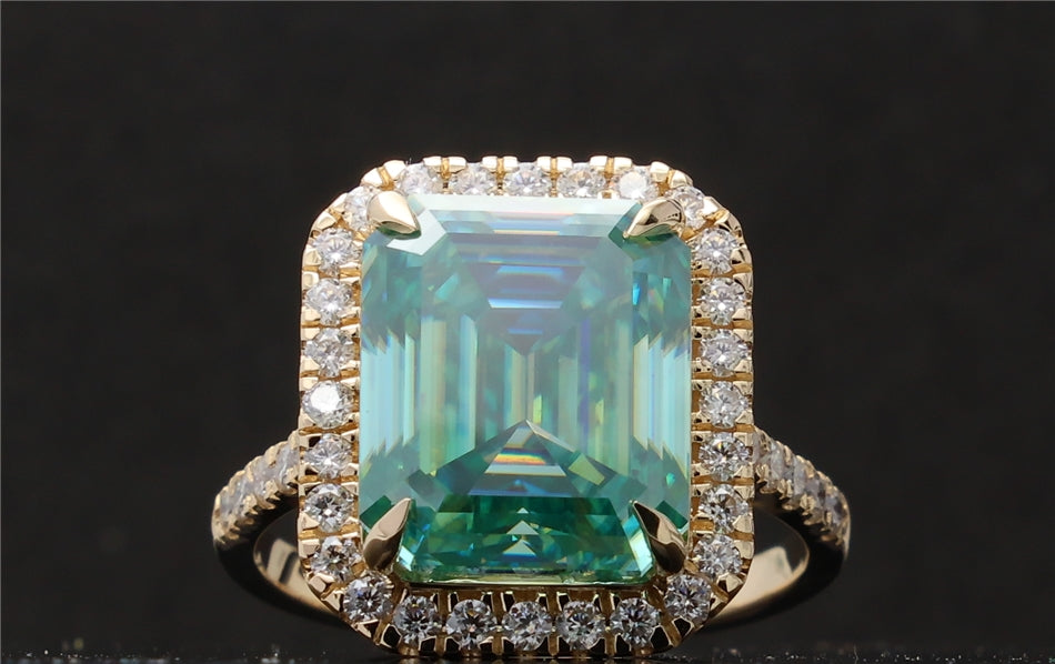 Top-down view showcasing the large 4 CT green emerald cut center stone surrounded by a brilliant halo.