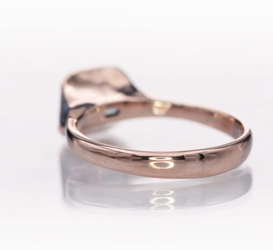 Back view showing the smooth, comfortable inner profile of the rose gold ring band.
