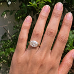 Full hand view showing a 3 CT horizontal oval lab diamond solitaire ring styled outdoors.