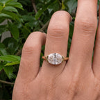 Top-down view on hand displaying the brilliance of a 3 CT East-West oval lab grown diamond.