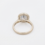 Perspective undergallery view displaying hidden bezel accent detail on a 3 CT round lab diamond ring.