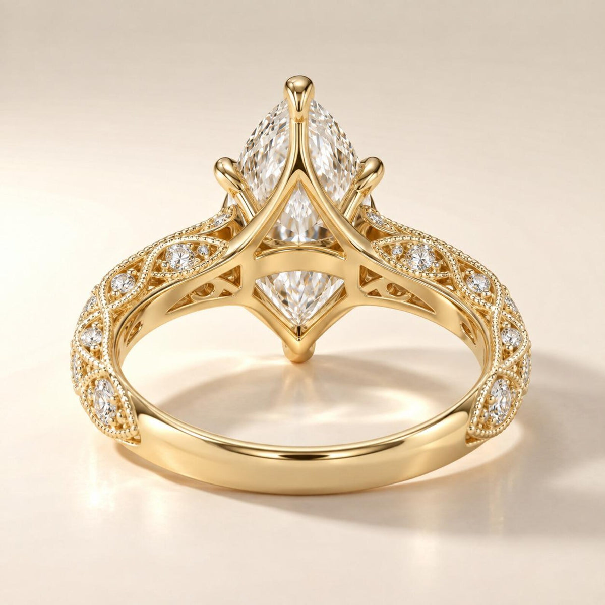 Detailed undergallery view showing open lattice gallery and milgrain design on a 4 CT marquise lab diamond yellow gold ring.