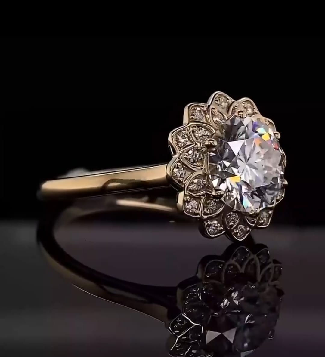 Angled top view of a round brilliant lab grown diamond ring showcasing the intricate diamond-encrusted petal halo design and plain gold band.