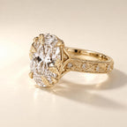 Angled side view showing detailed leaf-shaped prongs and floral vine hand-engraving with diamond accents.