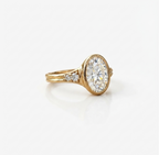 Perspective shot showing side accent diamonds set in tapered shoulders with a double-ridged band.