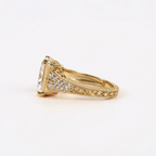 Side angle view of a 4 CT radiant cut lab diamond ring featuring double-row diamond pavé split shoulders and hand-engraved scrollwork on yellow gold.