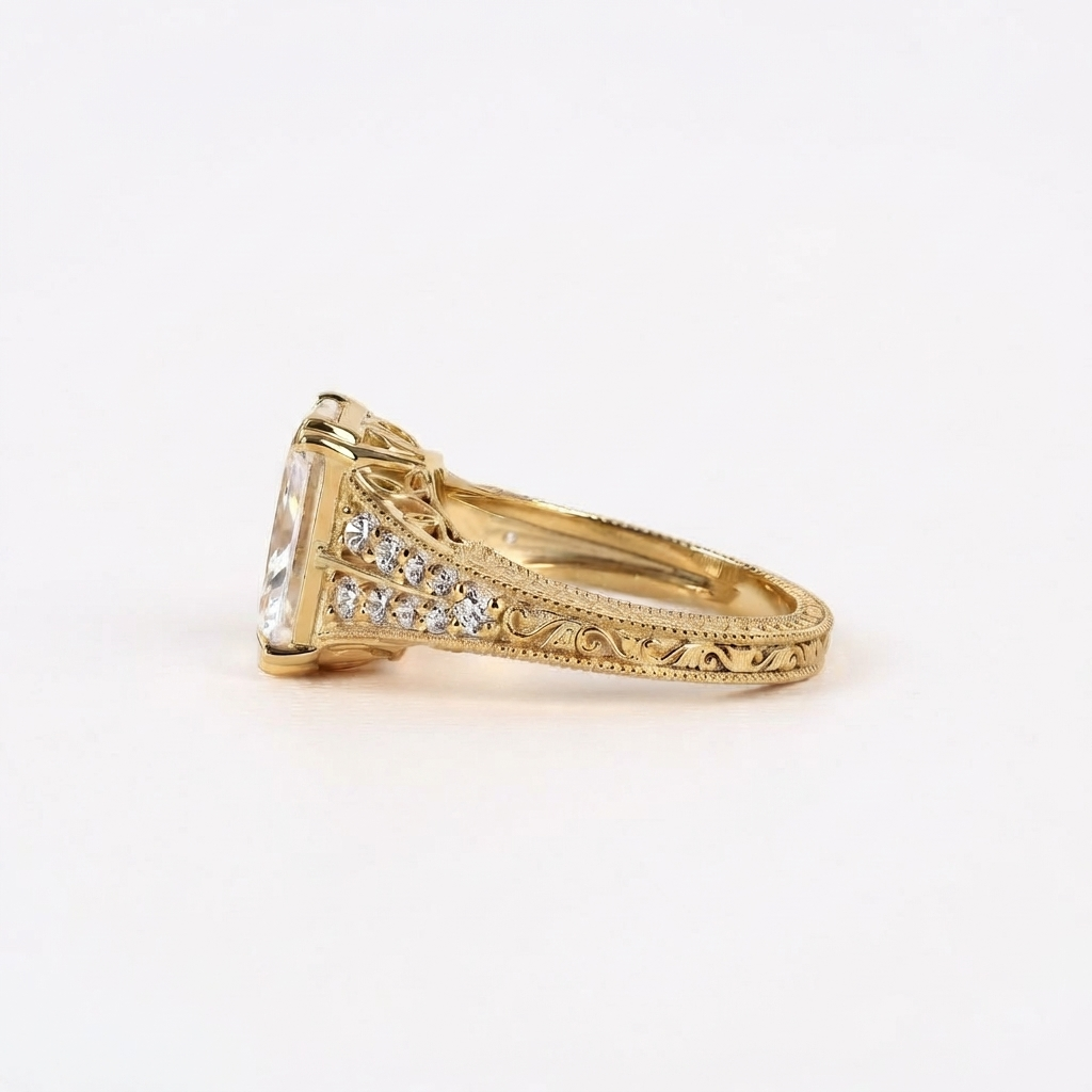 Side angle view of a 4 CT radiant cut lab diamond ring featuring double-row diamond pavé split shoulders and hand-engraved scrollwork on yellow gold.