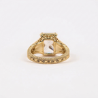 Bottom-up interior view highlighting the intricate carved scroll motifs, milgrain edges, and cathedral setting of the radiant cut ring.