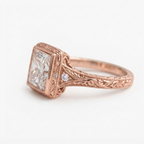 Side profile of a rose gold 4 CT princess lab diamond engagement ring displaying intricate hand-engraved filigree and milgrain edging.