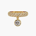 Front view of a 14K yellow gold twisted pavé band ring featuring a hanging bezel-set round lab diamond charm.
