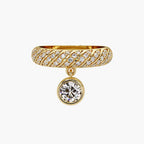 Front view of a 14K yellow gold twisted pavé band ring featuring a hanging bezel-set round lab diamond charm.