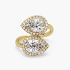 Top view of a 14K yellow gold Toi et Moi bypass ring featuring twin pear cut lab grown diamonds with micro-pavé halos.