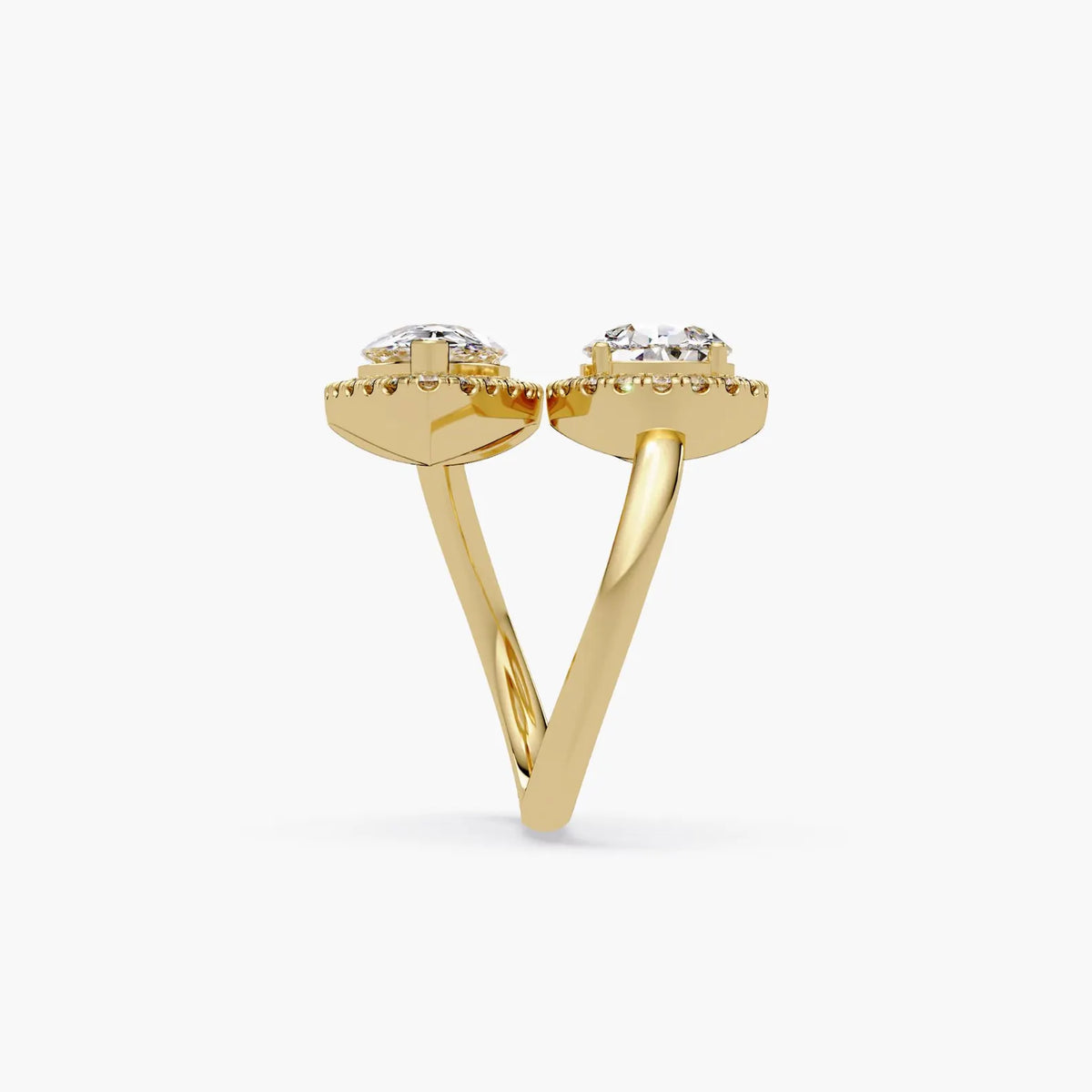 Top view of a rose gold Toi et Moi engagement ring with two halo-framed pear cut lab grown diamonds.