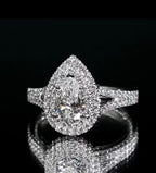 Striking top view of a 3 CT teardrop lab grown diamond double halo ring emphasizing its massive sparkle and elegant teardrop silhouette.