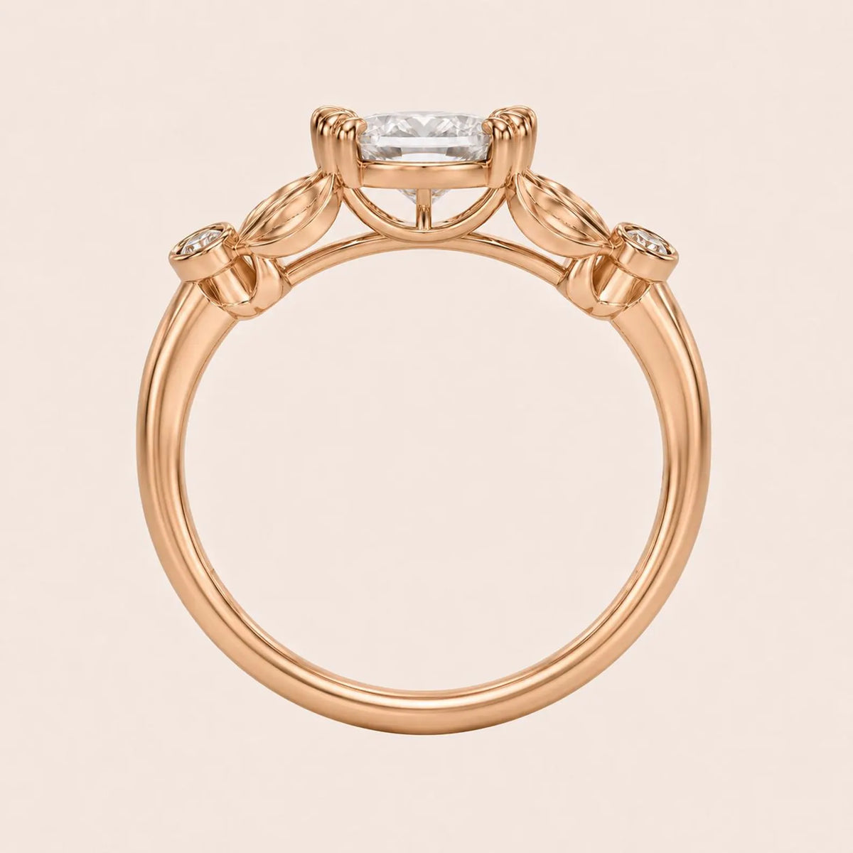 Side profile view of a rose gold 3 carat oval lab diamond ring showing double claw prongs and carved leaf setting.