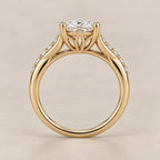 Profile view showing the cathedral petal basket undergallery supporting a 3 CT oval lab grown diamond ring.