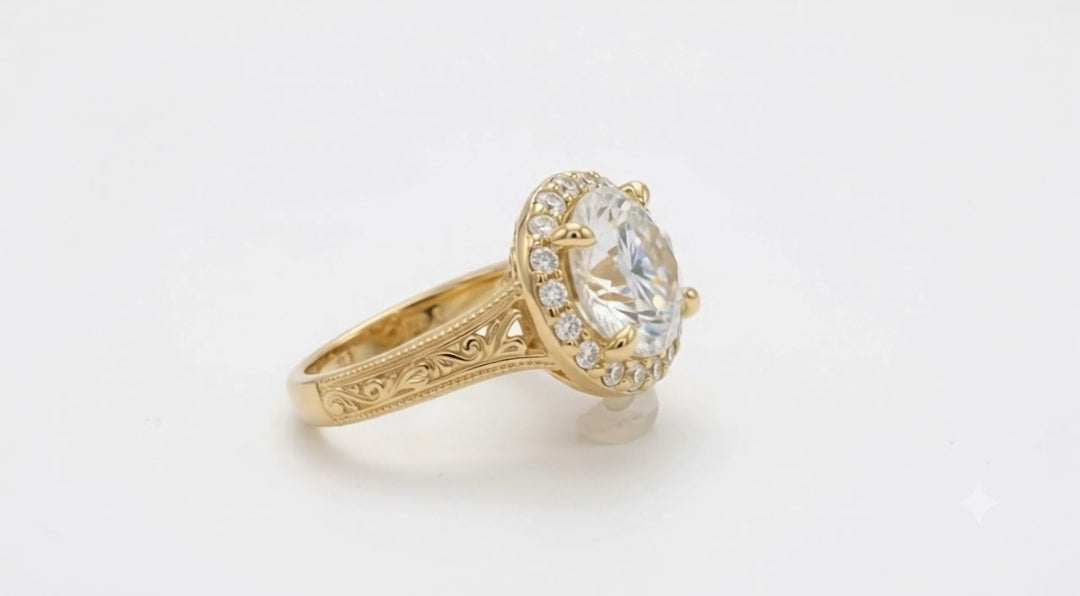Angled side view of a 4 CT round cut lab grown diamond halo ring with claw prongs and hand-engraved scrollwork shank in yellow gold.