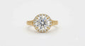 Direct top view of a 4 carat round brilliant lab diamond encased in a micro-pavé halo with milgrain-bordered engraved shoulders.