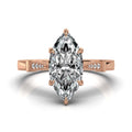 Top view of a 4 carat marquise cut lab grown diamond in a rose gold 6-prong setting with milgrain accented shoulders.