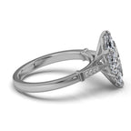 Angled perspective of a 4 carat marquise lab diamond engagement ring in white gold with milgrain edge accents.