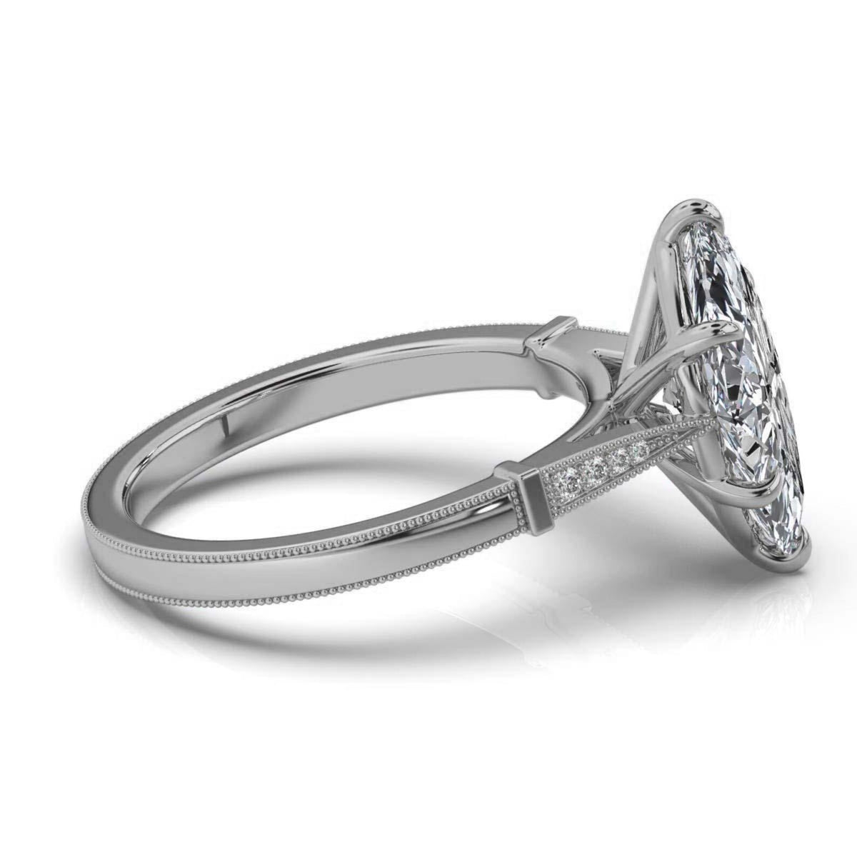 Angled perspective of a 4 carat marquise lab diamond engagement ring in white gold with milgrain edge accents.