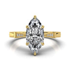 Top view of a 4 CT marquise cut lab grown diamond ring in yellow gold with 6-prong secure setting.