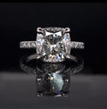 Direct top-down view of a breathtaking 3 CT cushion cut lab grown diamond engagement ring emphasizing its brilliant faceting and perfect symmetry.