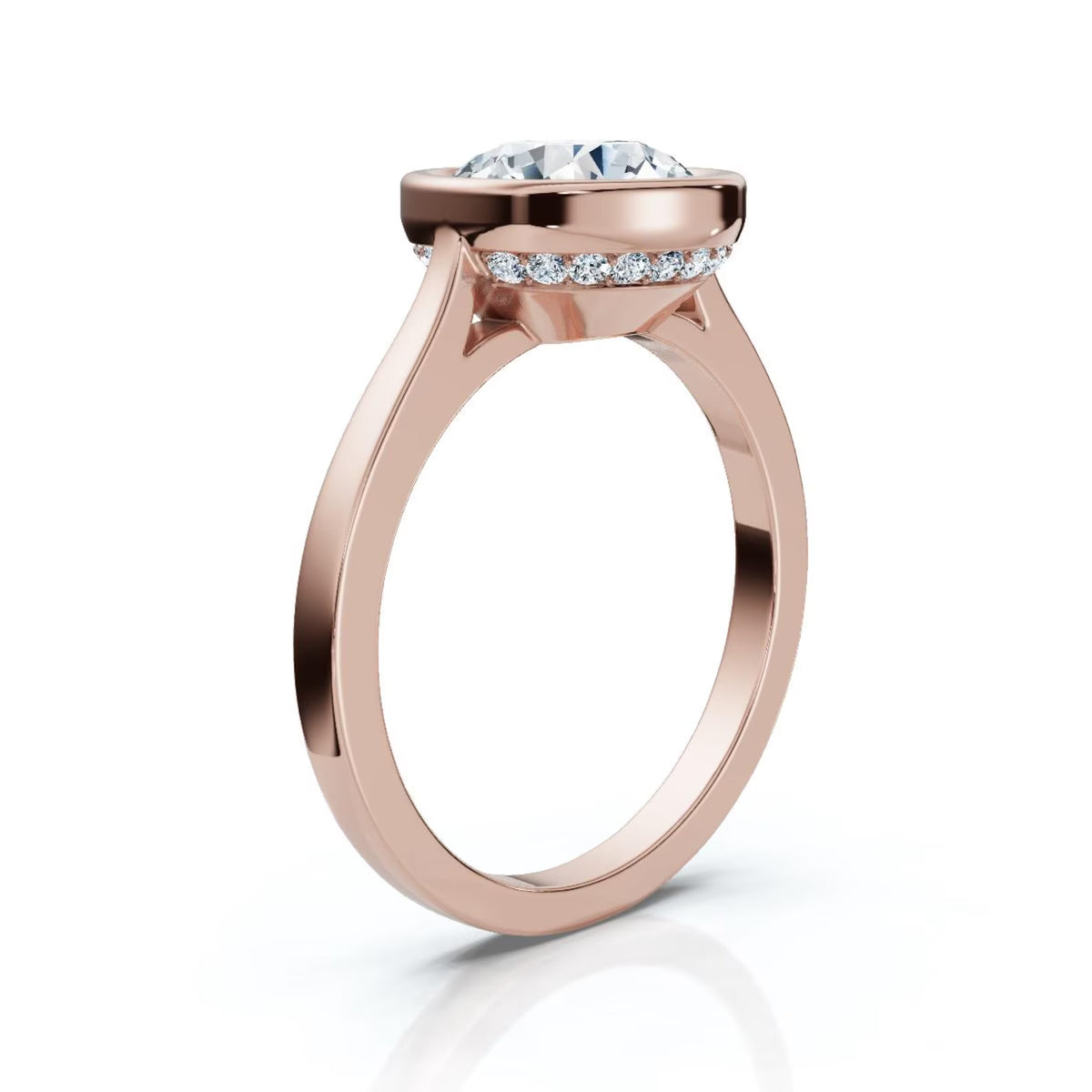Angled view of a 4 CT round lab grown diamond ring in rose gold with a sleek bezel setting and hidden diamond halo undergallery.
