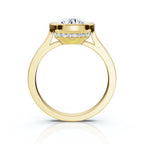 Direct side profile of a 4 carat round lab diamond ring in yellow gold highlighting the cathedral arch and hidden halo rim.