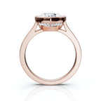 Direct side profile view of a rose gold 4 CT heart diamond bezel ring displaying the hidden micro-pavé halo collar.