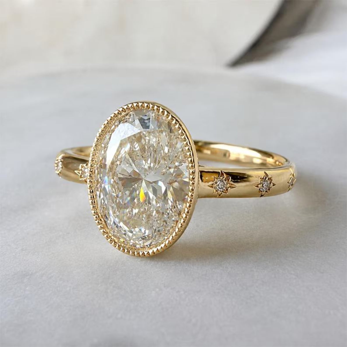Three-quarter view of a 5 carat oval lab diamond engagement ring with vintage milgrain border and celestial star-set diamonds.
