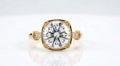 Top-down view of a 4 CT round cut lab diamond set inside a cushion-shaped milgrain frame with accent-set shoulders.