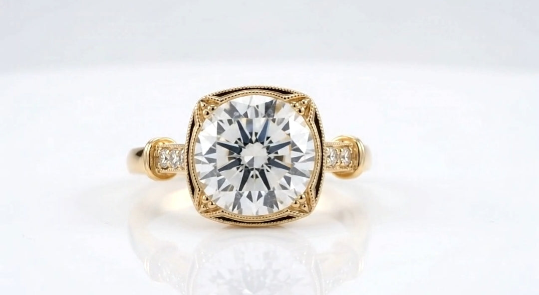 Top-down view of a 4 CT round cut lab diamond set inside a cushion-shaped milgrain frame with accent-set shoulders.