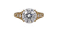 Top-down direct view of a 4 CT round brilliant cut lab grown diamond in a vintage hand-engraved yellow gold setting.