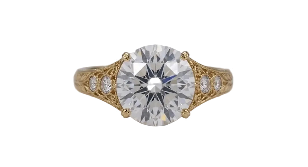 Top-down direct view of a 4 CT round brilliant cut lab grown diamond in a vintage hand-engraved yellow gold setting.