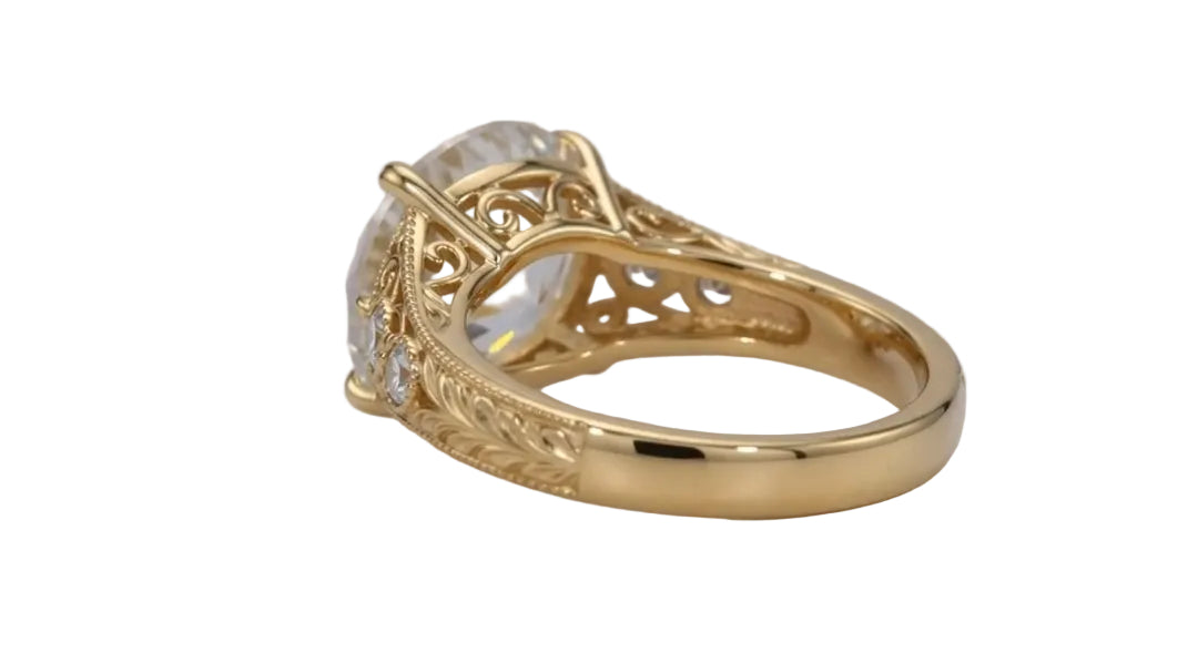 Side undergallery perspective showing high-polish yellow gold band transitioning to hand-engraved floral motifs.