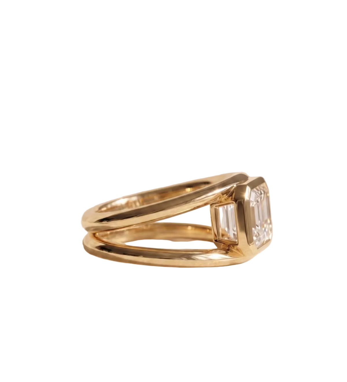 Profile side view of a 3 CT East-West horizontally set emerald cut lab diamond in a yellow gold full bezel setting on a double band shank.