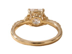 Undergallery side profile view of a yellow gold 2 CT cushion lab diamond ring showing the openwork basket structure.