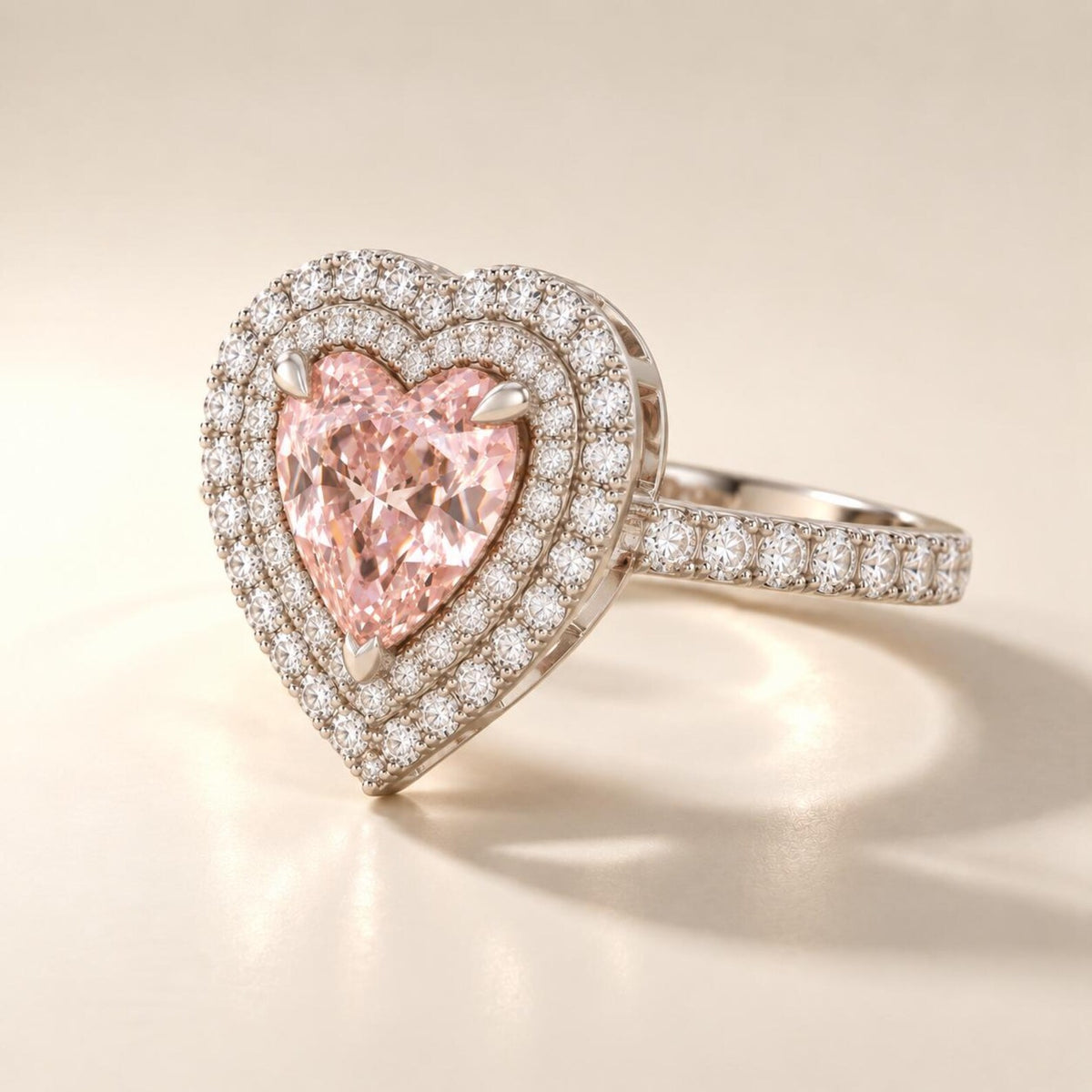 Perspective view of a 2 CT heart shaped fancy pink lab grown diamond ring with double micro-pavé framing.