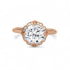 Top view of a 3 carat round lab grown diamond surrounded by a rose gold scalloped floral halo.