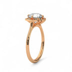 Perspective side view of a rose gold floral halo engagement ring with a smooth plain band.