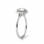 Angled view of a 3 CT round cut lab diamond floral halo engagement ring in white gold.