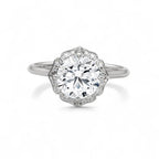 Top-down view showing a 3 carat round lab diamond set inside a white gold scalloped halo.