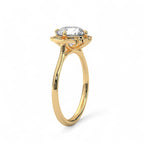 Perspective side view of a 3 CT round lab diamond floral halo ring in polished yellow gold.