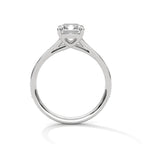 Direct side view of a white gold 4 CT emerald cut lab grown diamond ring displaying high setting profile.