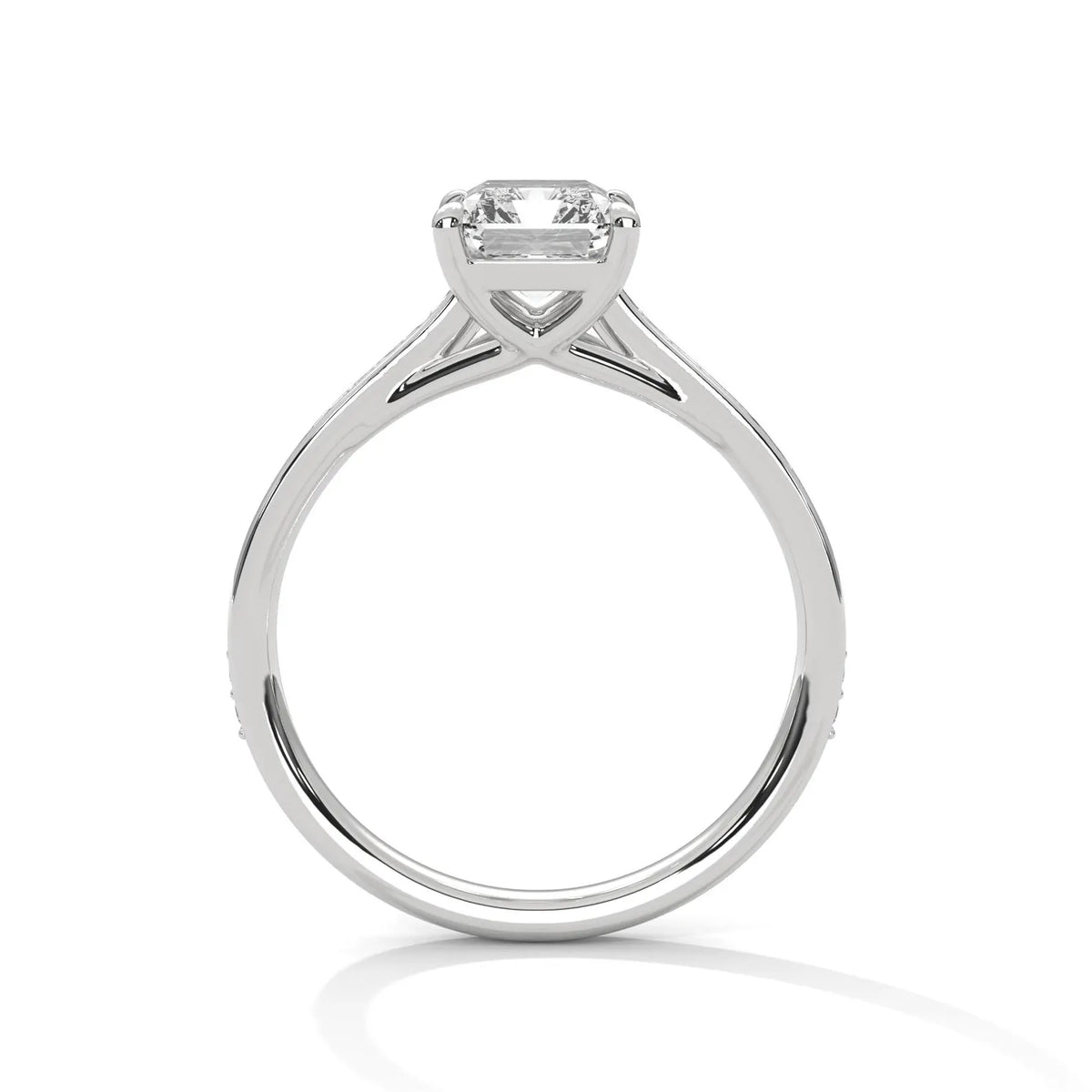 Direct side view of a white gold 4 CT emerald cut lab grown diamond ring displaying high setting profile.