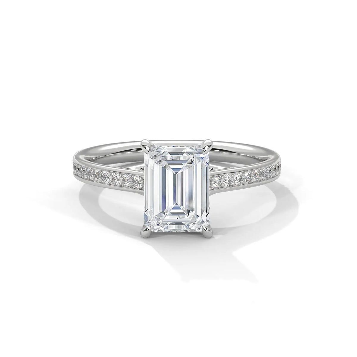 Direct top view of a white gold engagement ring featuring a 4 carat emerald cut lab grown diamond with pave accent band.