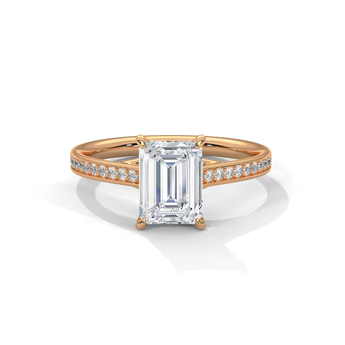 Top-down view of a 4 CT emerald cut lab diamond ring set in rose gold with micro-pavé diamond band.